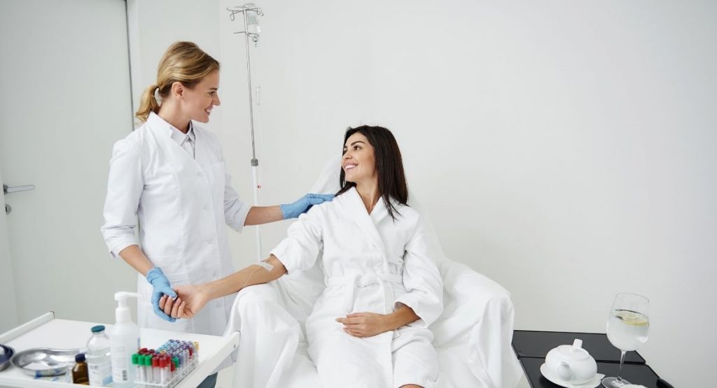 young woman having iv therapy