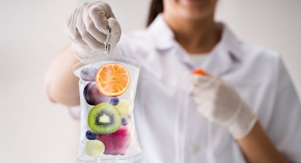 woman holding a iv therapy bag